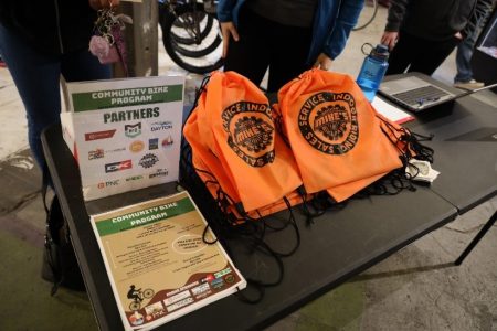 Bike park swag on table at Community Bike Program kick-off celebration