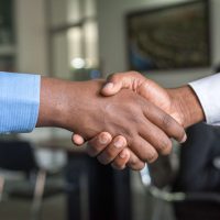 Two People Handshaking in Agreement